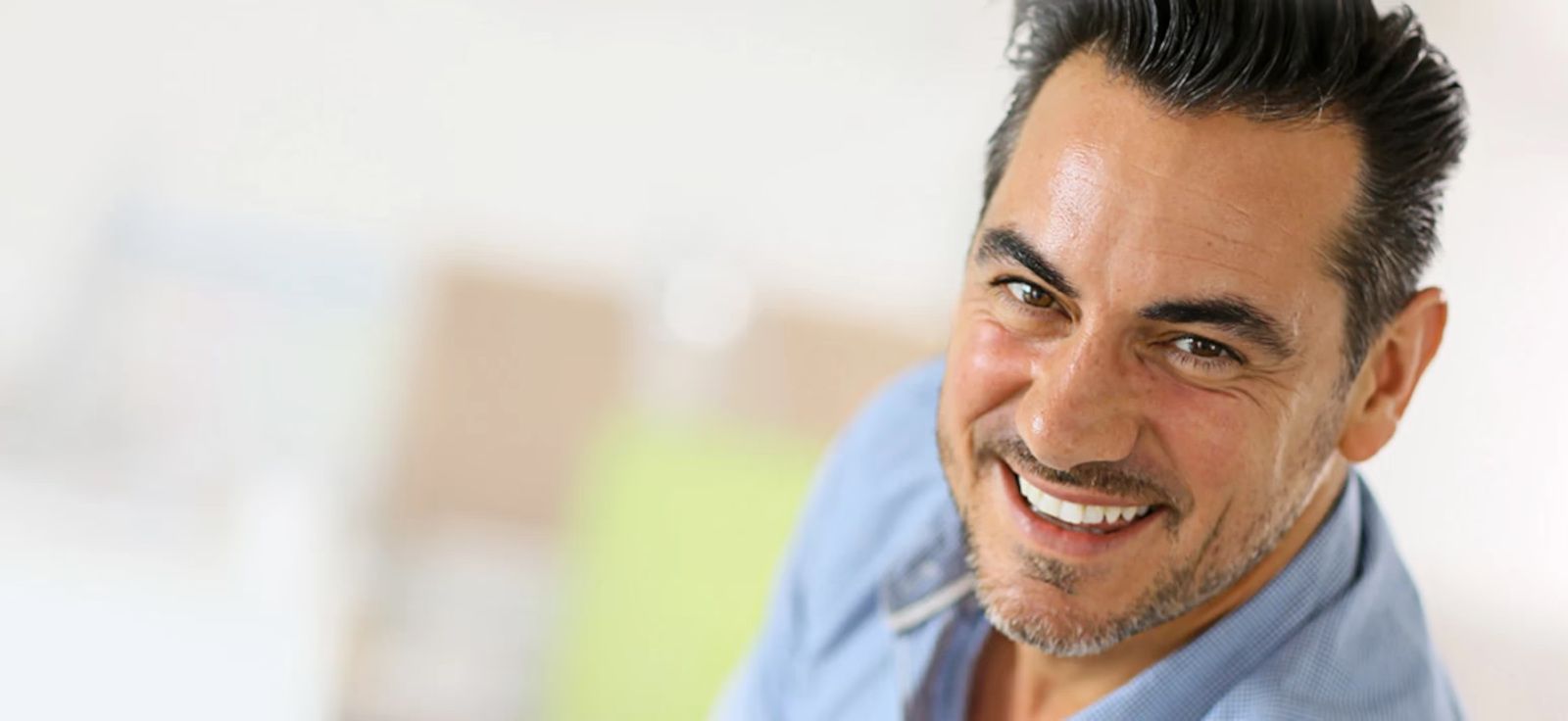 A confident patient smiling after personalized dental care